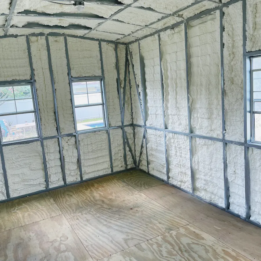 Closed-cell spray foam insulation applied to wall cavities in a residential project in Mendon